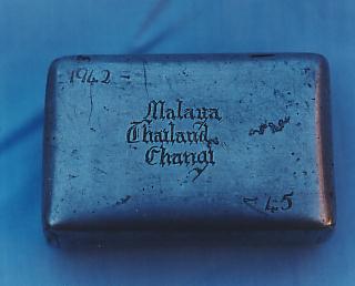 Tobacco tin  made from the baffle of a zero fighter bomber in 1945